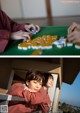 A man and a woman playing a game of mahjong.